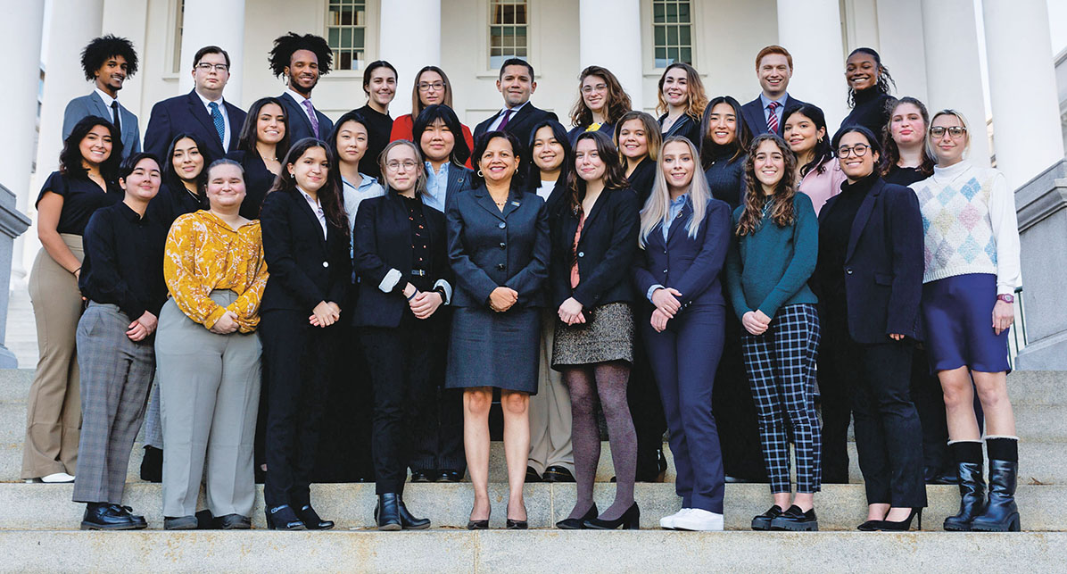 The 2022 Capitol Semester cohort poses with Wilder School Dean Susan Gooden on the steps of the Virginia Capitol building.